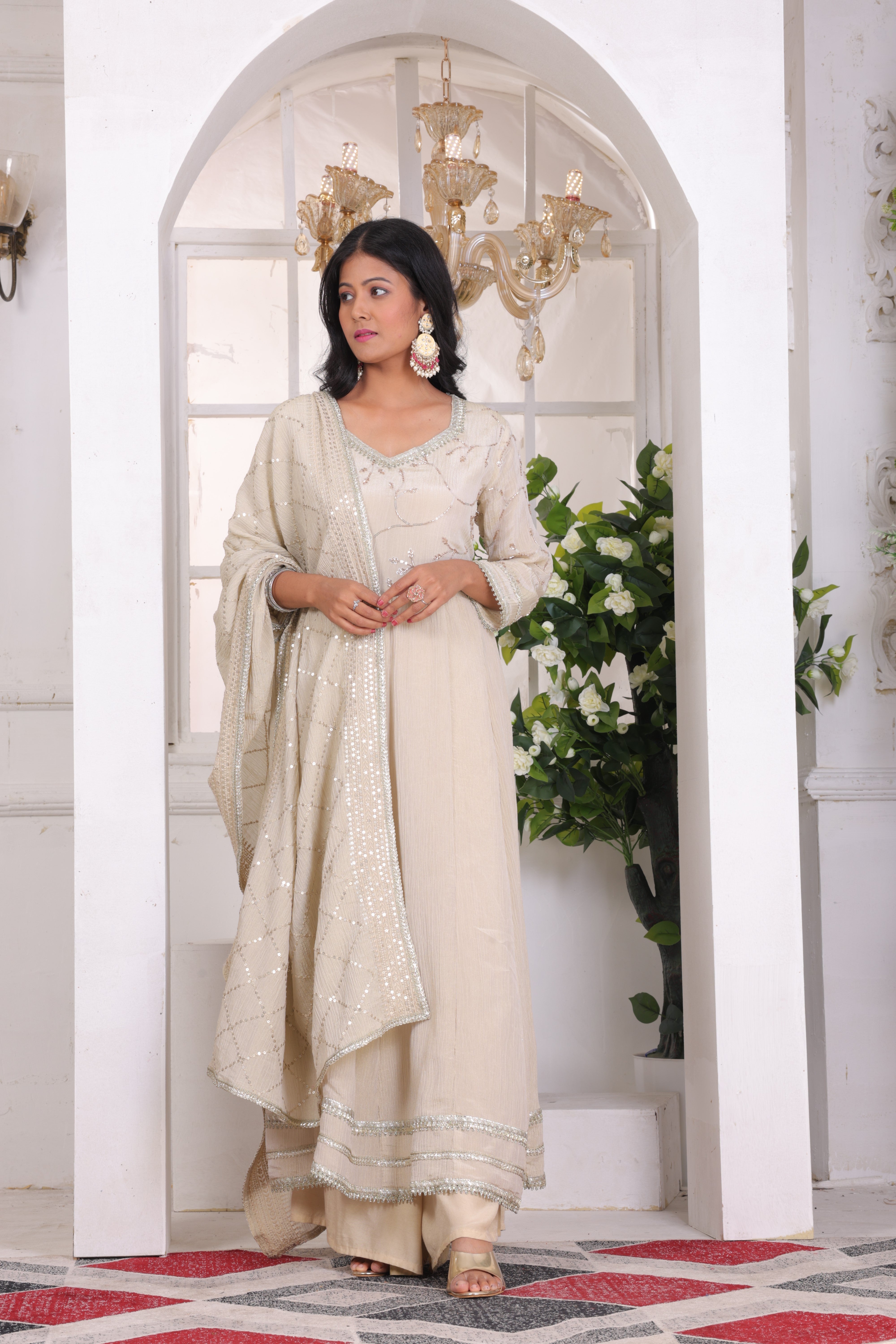 Crushed tissue top with handwork, tissue dupatta, and santoon bottom.
