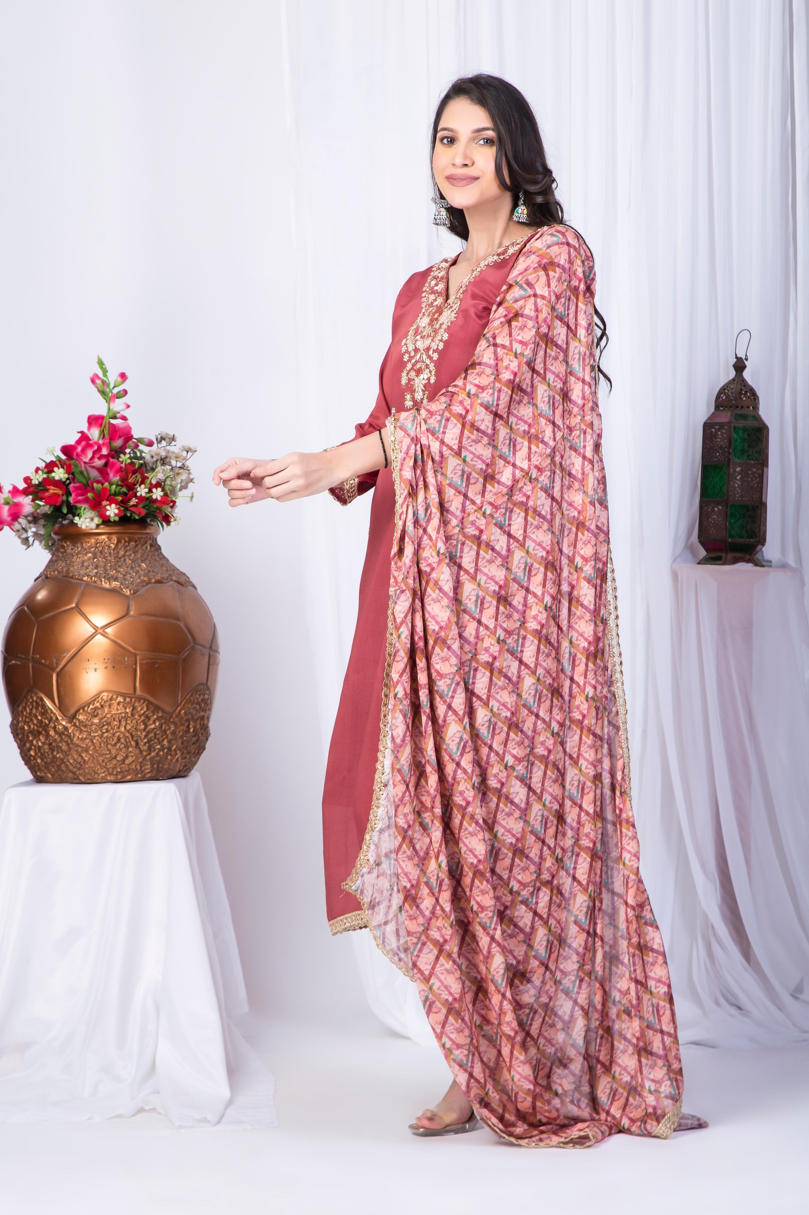 Warm Rustic Pure Chinon Fancy Neck Top paired with Chinon pritned dupatta and Bottom santoon