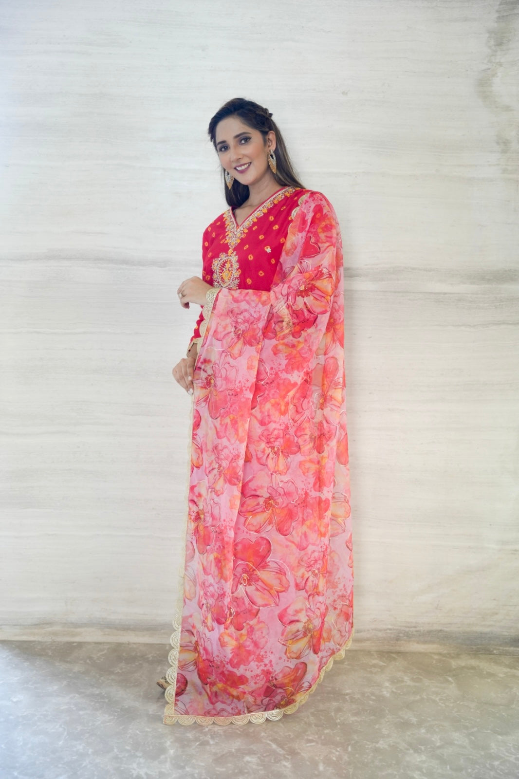 Bhandej Upada Silk Top, paired with printed Organza Dupatta and a Santoon bottom.